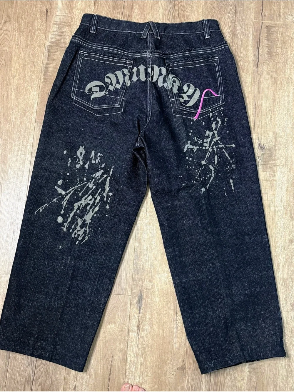 These wide-leg black jeans with white paint splatters Size 36x28